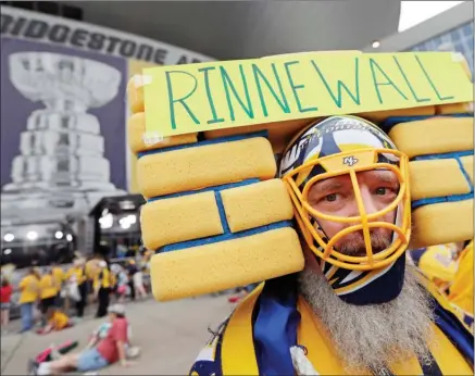  ?? The Associated Press ?? Nashville Predators fan Douglas Berg of Franklin, Tenn., shows his support for goalie Pekka Rinne before Game 4 of the NHL Stanley Cup final between the Nashville Predators and the Pittsburgh Penguins on Monday in Nashville,Tenn.