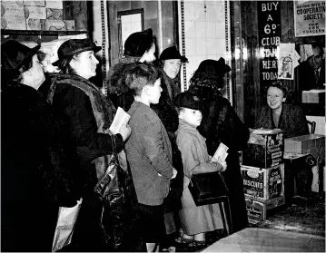  ??  ?? Women and children line up to register with the rationing service in 1939. “Studies suggest that the average Briton was better fed during the Second World War than ever before,” says Margaret MacMillan