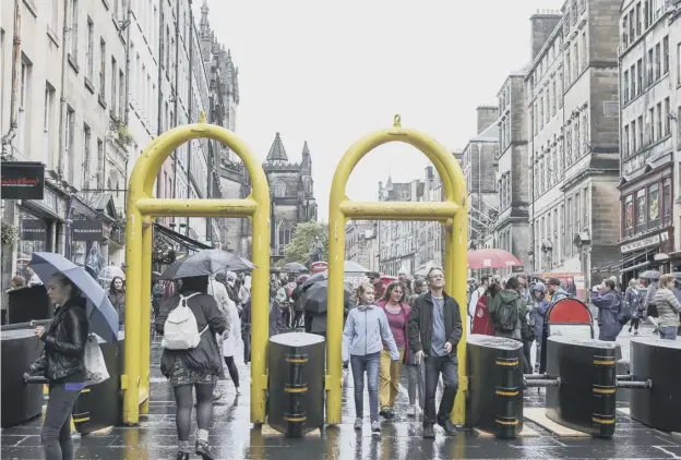  ??  ?? 0 Barriers on Edinburgh’s High Street were hastily errected after the the Manchester and London terror attacks, as well as the 2016 Bastille Day atrocity in Nice