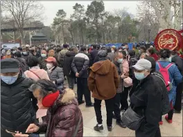  ?? KEITH BRADSHER — THE NEW YORK TIMES ?? Protesters gather outside Zhongshan Park in Wuhan, China, on Thursday to demand the repeal of recent cuts in government-provided medical insurance for seniors.