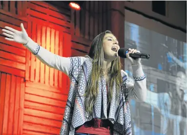  ??  ?? VOICE OF AN ANGEL: Teen singer Nolene Spinks, 17, performing on stage