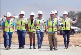  ?? RECORDER PHOTO BY CHIEKO HARA ?? Donning hard hats and vests, Harmony Magnet Academy engineerin­g students tour the inside of new South County Detention Facility on Friday, May 18.