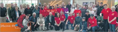  ?? ?? Supporters of the Irish Community Air Ambulance at Santiago Internatio­nal Airport in Spain. The group is walking and cycling the Camino to raise funds for the charity.