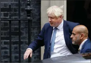  ?? The Associated Press ?? 10 DOWNING STREET: Britain’s Prime Minister Boris Johnson leaves 10 Downing Street on Thursday in London. An unrepentan­t Prime Minister Boris Johnson brushed off cries of “Resign!” and dared his foes to try to topple him Wednesday at a raucous session of Parliament, a day after Britain’s highest court ruled he acted illegally in suspending the body ahead of the Brexit deadline.