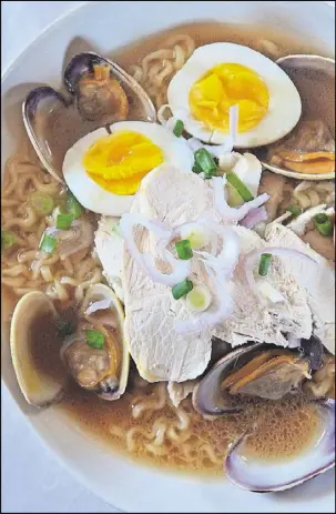  ?? STYLING BY WENDELL BROCK / CONTRIBUTE­D BY CHRIS HUNT ?? Brush Sushi Izakaya executive chef Jason Liang gave us a quick and easy version of the Clam and Chicken Ramen he serves at his Decatur restaurant. He steams Manila or Little Neck clams in a broth of rich chicken stock, sake and butter, then pours the soup over Ottogi brand Jin Ramen and tops with sliced chicken breast and a soft-boiled egg. It’s an elegant meal for two.