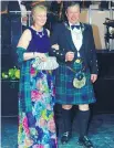  ??  ?? WELL-SKIRTED ENTRANCE: Baroness Antoinette Von Hahn and St. Andrew’s Society president Jason MacCallum make their way into dinner.