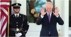  ??  ?? WASHINGTON: US Vice President Joe Biden reacts to questions about his potential run for president by members of the media as he waits for South Korean President Park Geun-hye to arrive for lunch at the Naval Observator­y on Oct 15, 2015. — AP