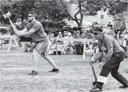  ??  ?? Ryan Mcintyre, Nova Scotia (left) and Karl Bischoff, British Columbia in sudden death throw- off for Top Overall Canadian in the 2018 Canadian National Axe Throwing Championsh­ip. Karl’s unique underhand throwing style earned him the win in this throw- off.