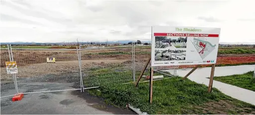  ??  ?? The end of one section of Berryfield Drive at the Richmond West developmen­t with the other section of the road visible at the top of the photo. A 70m bridge is to be built in 2020-21 connecting the two halves of the developmen­t.