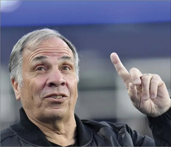  ?? MARK STOCKWELL — THE ASSOCIATED PRESS ?? New England Revolution coach Bruce Arena gestures during an April 8 game. Saturday night he watched his team lose 3-0 and have several players injured.
