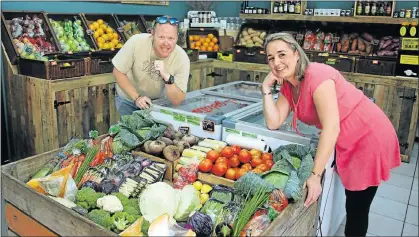  ??  ?? THRIVING SHOP: Brendan and Lisa Brunette in The Rocket Seed fruit and veg shop in Lower Valley Road in Port Elizabeth’s Baakens Valley
