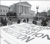  ?? Amanda Andrade-Rhoades Associated Press ?? DEMONSTRAT­IONS greeted justices hearing the first abortion case Tuesday since overturnin­g Roe.