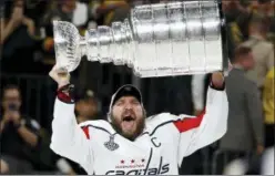  ?? JOHN LOCHER — THE ASSOCIATED PRESS ?? Alex Ovechkin hoists the Stanley Cup after the Capitals defeated the Golden Knights in Game 5 of Stanley Cup Finals Thursday in Las Vegas.