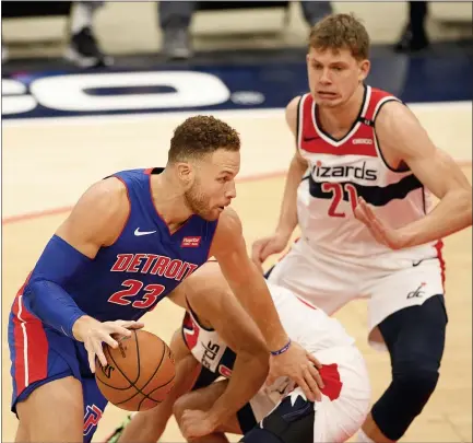  ?? NICK WASS — THE ASSOCIATED PRESS ?? Detroit Pistons forward Blake Griffin is pictured in action next to Washington Wizards center Moritz Wagner during the first half of a Dec. 17 preseason game in Washington.