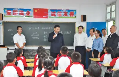  ??  ?? Chinese President Xi Jinping meets with fourth graders at a primary school in the county of Rucheng during his inspection tour in central China’s Hunan Province on Wednesday. Xi has encouraged rural primary school students to strive to grow from “saplings” into “towering trees” of the Chinese nation. He told the students that the revolution­ary cause must be passed down from one generation to the next. — Xinhua