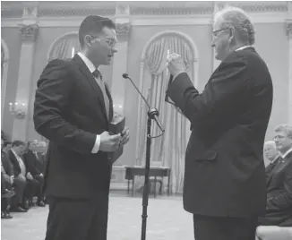  ?? Adrian wyld/canadian Press ?? Pierre Poilievre, 34, is sworn in as the minister of state for democratic reform at Rideau Hall on Monday.