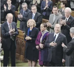  ?? SEAN KILPATRICK / THE CANADIAN PRESS ?? The Aga Khan, spiritual leader of the Ismaili Muslims, is applauded as he arrives to deliver an address on Parliament Hill in 2014.