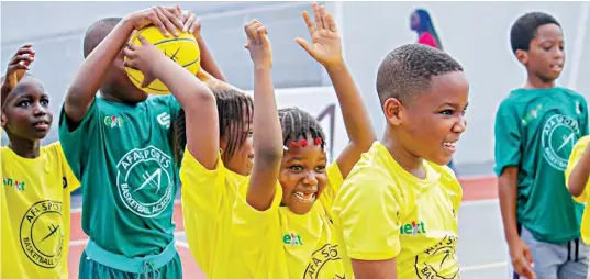  ??  ?? Children learning the rudiments of basketball from experts during a recent CBL clinic in Lagos.