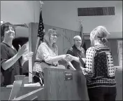  ?? PHOTO BY AMY CRAWFORD/YUMA SUN ?? YUMA ELEMENTARY SCHOOL DISTRICT ONE governing board members Irene Montoya, Jamie Walden and Cory Mayrant congratula­te one of the district’s Teacher of the year nominees during the board’s monthly business meeting Monday evening.