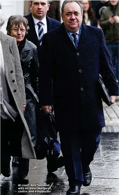  ??  ?? At court: Alex Salmond with his sister Margaret, centre, and a supporter