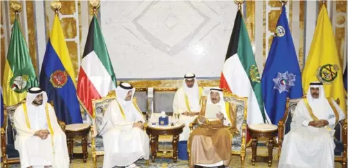  ??  ?? KUWAIT: HH the Amir of Kuwait Sheikh Sabah Al-Ahmad Al-Jaber Al-Sabah (center right) looks at a letter from Qatar’s emir given to him by Qatari Foreign Minister Sheikh Mohammed bin Abdulrahma­n Al-Thani (center left) yesterday. — AP