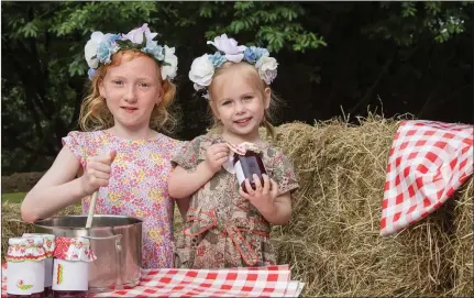  ??  ?? Saidbh Linden, Bray and Isadora Hogan from Stepaside practice their jam making skills in practice for the Enniskerry Field Day, which will take place on Sunday 10th September on Monastery Road, Enniskerry this year.