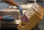  ?? JEFF CHIU — THE ASSOCIATED PRESS FILE ?? Envelopes containing ballots are shown at a voting center in San Francisco.