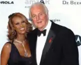  ??  ?? In this file photo taken on May 24, 2002 French fashion designer Hubert de Givenchy and Somalian-born model Iman pose for photograph­ers as they arrive at the amFar (American Foundation for Aids Research) benefit party in Mougins, near Cannes.