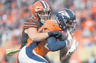  ??  ?? The Broncos’ Noah Fant makes a catch as Cleveland’s Joe Schobert defends last season. Schobert, or the Rams’ Cory Littleton, would cost more than $50 million over four years but could be key to helping Broncos coach Vic Fangio’s defense.
