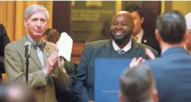  ?? STEVE HELBER/AP ?? Rodney Robinson, right, is the National Teacher of the Year.