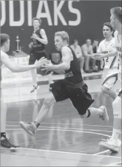  ?? Herald photo by Dale Woodard ?? Landon Veluw of the Immanuel Christian Eagles drives to the basket during the 2A boys gold medal game against the Claresholm Willow Creek Cobras at the 1A/2A Boys and Girls Southern Alberta zone high school basketball tournament Saturday night at the...