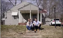  ?? CHARLIE RIEDEL — THE ASSOCIATED PRESS ?? Logan DeWitt with his wife Mckenzie and daughter Elizabeth at their home in Kansas City, Kan. Because he could work at home, Logan kept his job through the pandemic while his wife lost hers and went back to school. Their financial situation was further complicate­d with the birth of their daughter nine months ago.