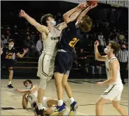  ?? OWEN MCCUE — MEDIANEWS GROUP ?? Pope John Paul II’s Justin Green (21) goes up for a shot on Allentown Central Catholic’s Liam Joyce (11) in a PIAA-4A playoff game Tuesday.