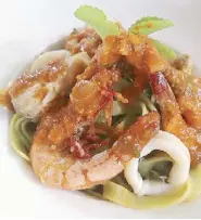  ??  ?? Tagliatell­e frutti di mare, tagliatell­e pasta with shrimps, fish and squid.