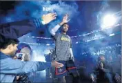  ?? Ronald Martinez Getty Images ?? LAKERS GUARD D’Angelo Russell is introduced before Rising Stars Challenge. He scored 10 points.