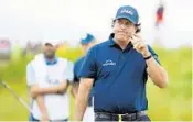  ?? ROSS KINNAIRD/GETTY IMAGES ?? Phil Mickelson reacts to a shot on the 11th green during Friday’s second round.