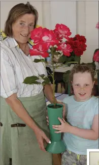  ??  ?? Catherine Coveney and her prize-winning roses with Catherine Lowe at the Delgany and District Horticultu­ral Society Rose Show at St Patrick’s NS, Greystones.