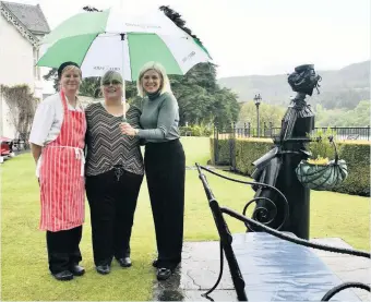  ??  ?? Celebratin­g success Even a drop of rain cannot dampen the spirits of Green Park Hotel staff Mhairi Young (left), June Ann Gallacher (centre) and Terry Edwards