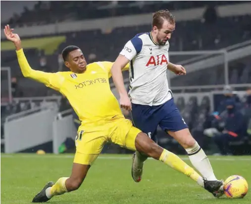  ?? ?? Tosin Adarabioyo tries to stop Harry Kane when Tottenham hosted Fulham in the Premier League last season