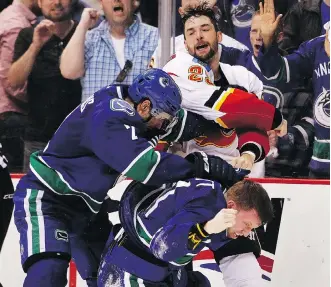  ?? BEN NELMS/GETTY IMAGES ?? Flames defenceman Deryk Engelland still hears about the night when he fought two Canucks players, Dan Hamhuis and Derek Dorsett, during a playoff game at Rogers Arena in Vancouver.