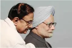  ?? —AFP ?? MUMBAI: Indian Prime Minister Manmohan Singh (right) and Finance Minister P Chidambara­m arrive for the function to celebrate the Silver Jubilee of Securities and Exchange Board of India (SEBI) yesterday.