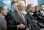  ?? ANDREW HARNIK/AP ?? Majority Leader Steny Hoyer of Maryland, center, and several colleagues focus Tuesday on ratcheting up gun control.