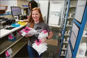  ?? Chris Carlson / Associated Press ?? Christina McGowan fills orders at the Table Rock Pharmacy on Friday in Morganton, N.C. Drugstore chains are still trying to find enough employees to put a stop to temporary pharmacy closures.