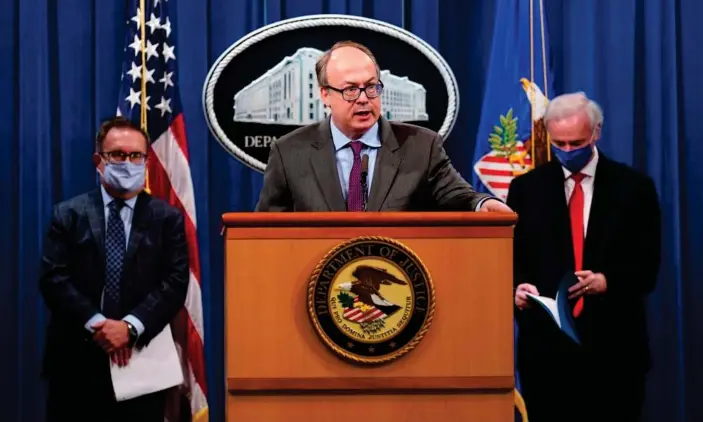  ?? Photograph: Susan Walsh/AFP/Getty Images ?? Jeffrey Clark speaks as the then deputy attorney general, Jeffrey Rosen, right, and the then EPA administra­tor, Andrew Wheleer, left, listen in Washington DC in September 2020.