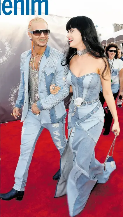  ?? FRAZER HARRISON/ GETTY IMAGES/ FILES ?? Riff Raff, left, and Katy Perry arrive at the 2014 MTV Video Music Awards in glorious double-denim outfits.