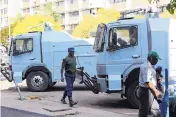  ?? TSVANGIRAY­I MUKWAZHI/ASSOCIATED PRESS ?? Police water cannons are seen in the Zimbabwe capital, Harare, on Tuesday as the country awaits the first results from the presidenti­al election.