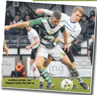  ??  ?? Ashford striker Jon Pilbeam holds the ball up