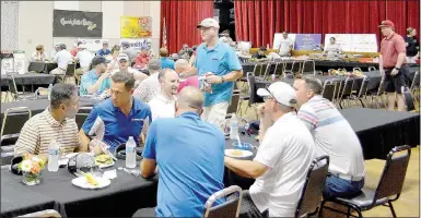  ?? Keith Bryant/The Weekly Vista ?? Golfers and volunteers eat lunch in the Riordan Hall ballroom.