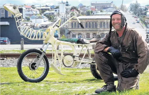  ??  ?? Heavy metal pedal moa . . . Matt King sees a lot of rubberneck­ers these days, when he takes his moa bike on Oamaru streets.