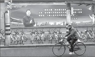  ??  ?? SHANGHAI
Chinese President Xi Jinping overlook a street ahead of the National People's Congress (NPC), in Shanghai, China.
-APP